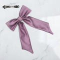 Tuhil Threads Lilac Royal Micro Satin Long Tail Bow. Luxurious satin hair bow for an elegant, chic accent. Shop Tuhil Threads hair accessories.