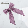Tuhil Threads Lilac Royal Micro Satin Long Tail Bow. Luxurious satin hair bow for an elegant, chic accent. Shop Tuhil Threads hair accessories.