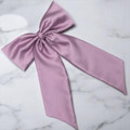 Tuhil Threads Lilac Royal Micro Satin Statement Long Tail Bow. Luxurious satin hair bow for an elegant, stylish accent. Shop Tuhil Threads hair accessories.