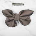 Tuhil Threads small taupe Royal Micro Satin butterfly bow (10x6cm) showcasing its elegant shape and rich colour. Shop Tuhil Threads hair accessories.