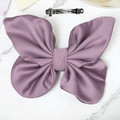 Tuhil Threads medium lilac Royal Micro Satin butterfly bow showcasing its rich, deep colour and elegant shape. Shop Tuhil Threads hair accessories.