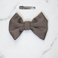 Tuhil Threads Small Taupe Royal Micro Satin Classic Bow, front view, highlighting its smooth texture and sophisticated neutral tone. Shop Tuhil Threads hair accessories.