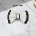 Tuhil Threads Small Royal Micro Satin Classic Bow in a two-tone design with a taupe bottom layer and a cream top layer, neatly tied. Shop Tuhil Threads hair accessories.