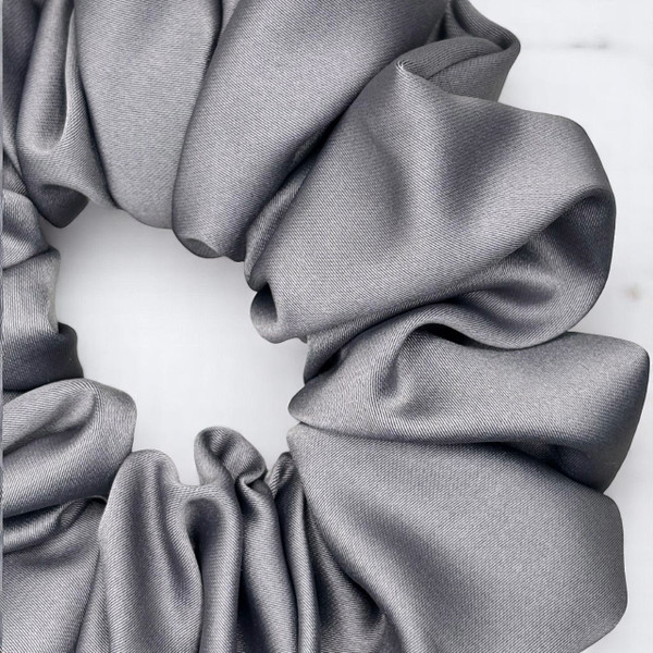 Tuhil Threads Large Grey Royal Micro Satin Scrunchie. Luxurious large satin hair tie for a gentle, stylish hold. Shop Tuhil Threads hair accessories.
