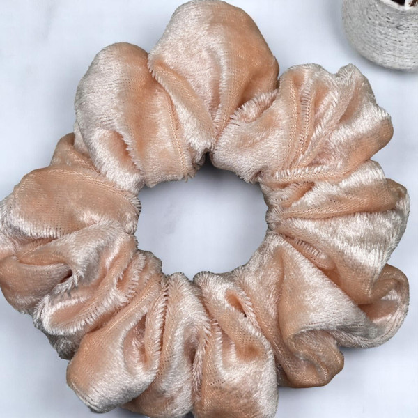 Tuhil Threads Medium Peach Velvet Scrunchie. Soft, rich medium velvet hair tie for an elegant, gentle hold. Shop Tuhil Threads hair accessories.