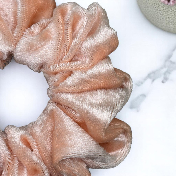 Tuhil Threads Medium Peach Velvet Scrunchie. Soft, rich medium velvet hair tie for an elegant, gentle hold. Shop Tuhil Threads hair accessories.