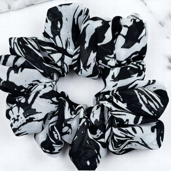 Tuhil Threads Large Black and White Abstract Print Chiffon Scrunchie. Lightweight large chiffon hair tie with a bold monochrome design for a stylish, gentle hold. Shop Tuhil Threads hair accessories