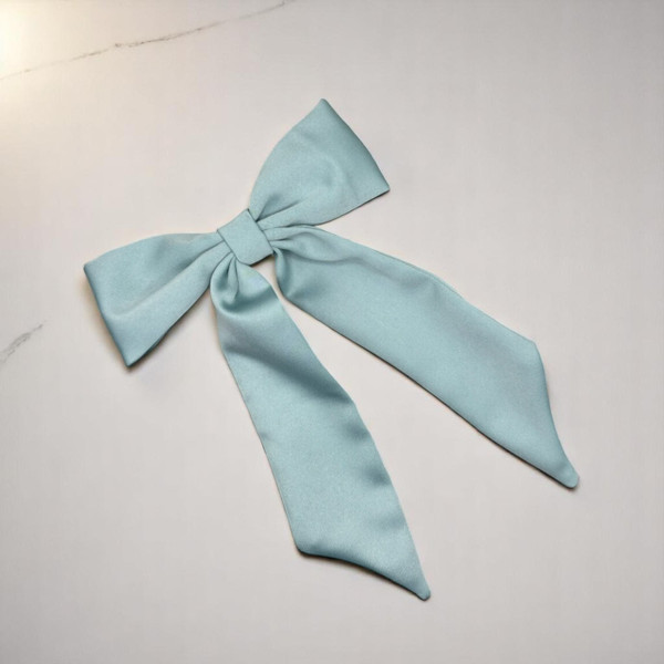 Tuhil Threads Mint Green Royal Micro Satin Long Tail Bow. Luxurious satin hair bow for an elegant, chic accent. Shop Tuhil Threads hair accessories.