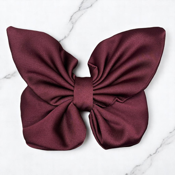 Tuhil Threads medium burgundy Royal Micro Satin butterfly bow showcasing its rich, deep colour and elegant shape. Shop Tuhil Threads hair accessories.