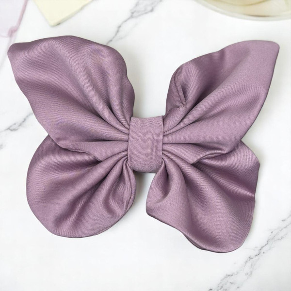 Tuhil Threads medium lilac Royal Micro Satin butterfly bow showcasing its rich, deep colour and elegant shape. Shop Tuhil Threads hair accessories.