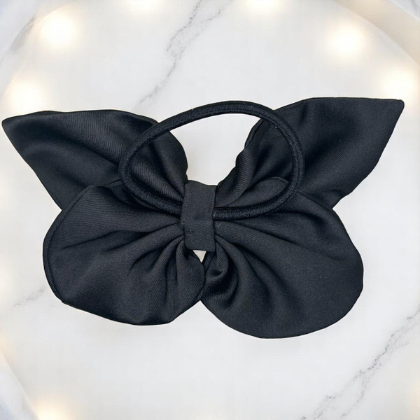 Tuhil Threads medium black Royal Micro Satin butterfly bow (12x8cm) showcasing its deep classic colour and elegant, bold shape. Shop Tuhil Threads hair accessories.
