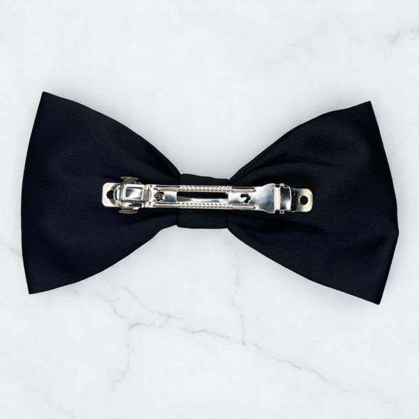 Tuhil Threads Large Black Royal Micro Satin Classic Bow, front view, showcasing its sleek finish and statement size. Shop Tuhil Threads hair accessories.