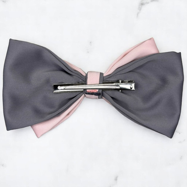 Tuhil Threads Large Royal Micro Satin Classic Bow in a two-tone design with a cool grey bottom layer and a soft pink top layer, neatly tied, measuring 17x10cm. Shop Tuhil Threads hair accessories.