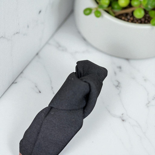 Black knotted fabric aliceband. Shop at Tuhil Threads. Black knotted fabric aliceband. Shop at Tuhil Threads.