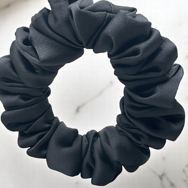 Tuhil Threads Small Black Royal Micro Satin Scrunchie. Luxurious small satin hair tie for a gentle, stylish hold. Shop Tuhil Threads hair accessories