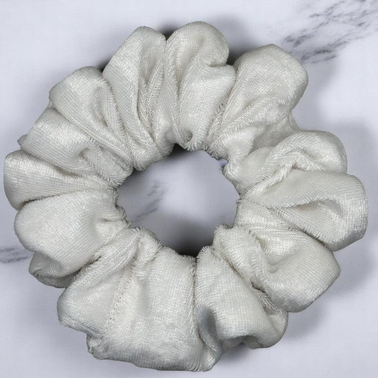Tuhil Threads Medium Ivory Velvet Scrunchie. Soft, rich medium velvet hair tie for an elegant, gentle hold. Shop Tuhil Threads hair accessories.
