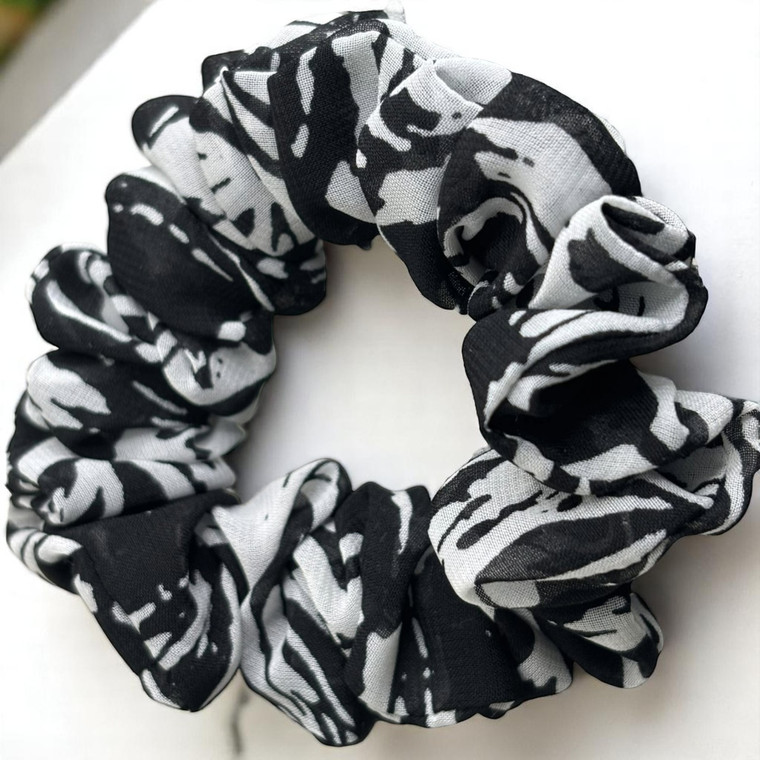 Tuhil Threads Small Black and White Abstract Print Chiffon Scrunchie. Lightweight Small chiffon hair tie with a bold monochrome design for a stylish, gentle hold. Shop Tuhil Threads hair accessories