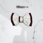 Tuhil Threads Small Royal Micro Satin Classic Bow in a two-tone design with a rich burgundy bottom layer and a cream top layer, neatly tied. Shop Tuhil Threads hair accessories.