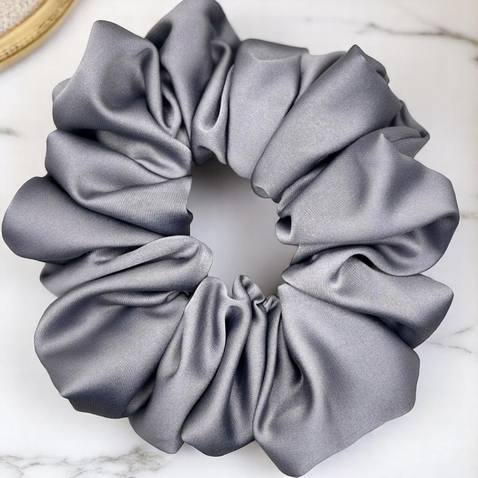 Tuhil Threads Large Grey Royal Micro Satin Scrunchie. Luxurious large satin hair tie for a gentle, stylish hold. Shop Tuhil Threads hair accessories.