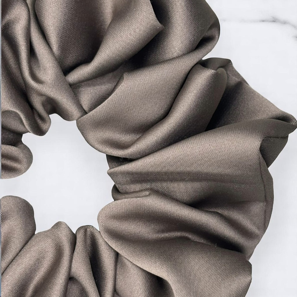 Tuhil Threads Large Taupe Royal Micro Satin Scrunchie. Luxurious large satin hair tie for a gentle, stylish hold. Shop Tuhil Threads hair accessories.