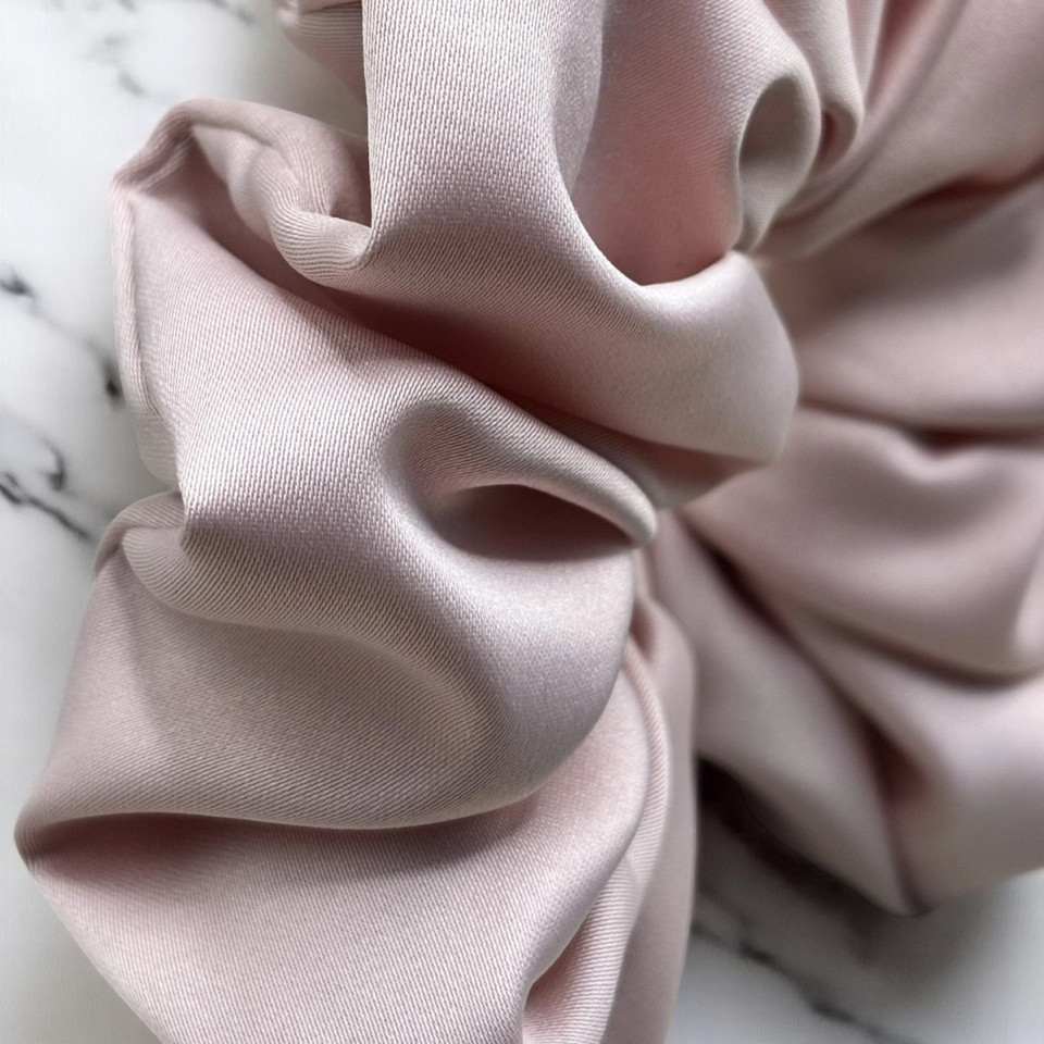 Tuhil Threads Large Soft Pink Royal Micro Satin Scrunchie. Luxurious large satin hair tie for a gentle, stylish hold. Shop Tuhil Threads hair accessories.