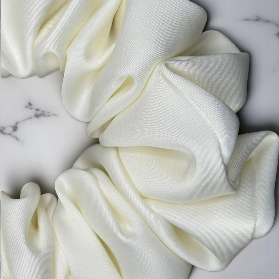 Tuhil Threads Large Cream Royal Micro Satin Scrunchie. Luxurious large satin hair tie for a gentle, stylish hold. Shop Tuhil Threads hair accessories.