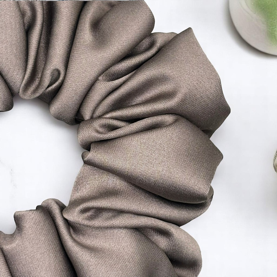 Tuhil Threads Medium Taupe Royal Micro Satin Scrunchie. Luxurious medium satin hair tie for a gentle, stylish hold. Shop Tuhil Threads hair accessories.