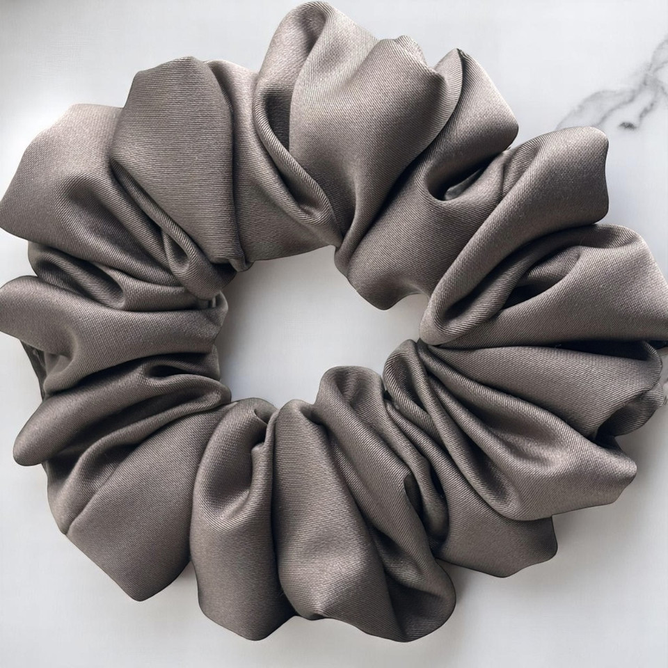 Tuhil Threads Medium Taupe Royal Micro Satin Scrunchie. Luxurious medium satin hair tie for a gentle, stylish hold. Shop Tuhil Threads hair accessories.