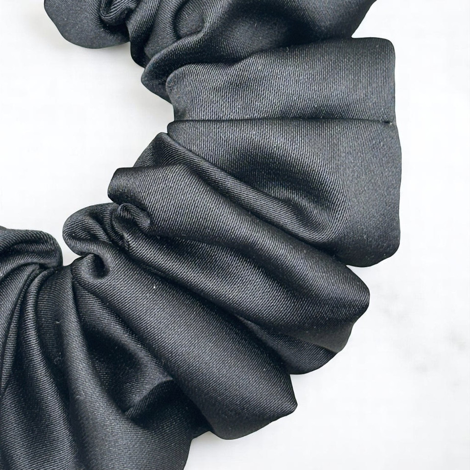Tuhil Threads Medium Black Royal Micro Satin Scrunchie. Luxurious medium satin hair tie for a gentle, stylish hold. Shop Tuhil Threads hair accessories.