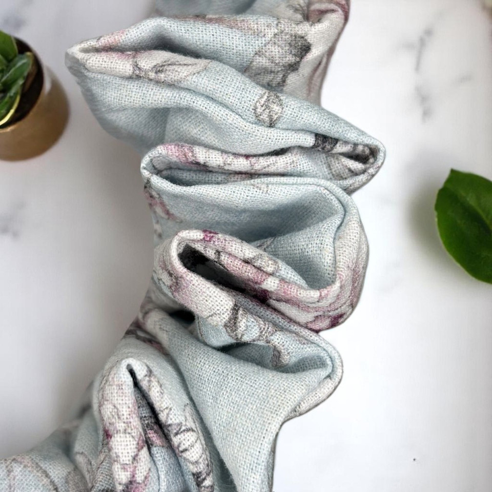 Tuhil Threads Medium Floral Print John Louden Cotton Scrunchie. Soft, breathable medium cotton hair tie made with premium John Louden fabric for comfortable everyday style and a gentle hold. Shop Tuhil Threads hair accessories.