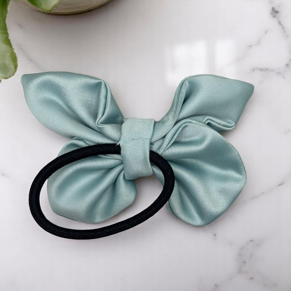 Tuhil Threads small Mint Green Royal Micro Satin butterfly bow (10x6cm) showcasing its elegant shape and rich colour. Shop Tuhil Threads hair accessories.