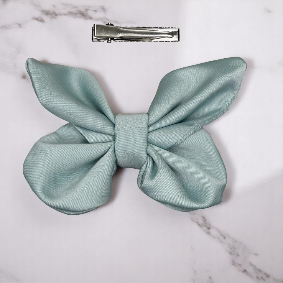 Tuhil Threads small Mint Green Royal Micro Satin butterfly bow (10x6cm) showcasing its elegant shape and rich colour. Shop Tuhil Threads hair accessories.