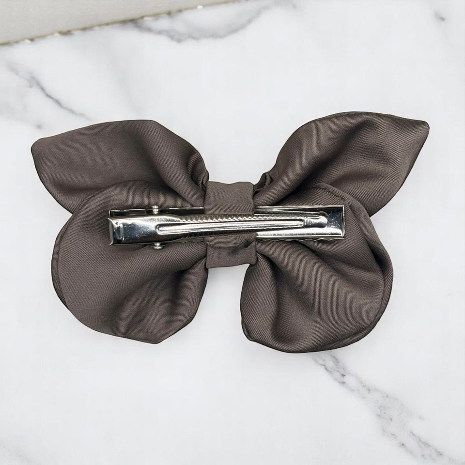 Tuhil Threads small taupe Royal Micro Satin butterfly bow (10x6cm) showcasing its elegant shape and rich colour. Shop Tuhil Threads hair accessories.