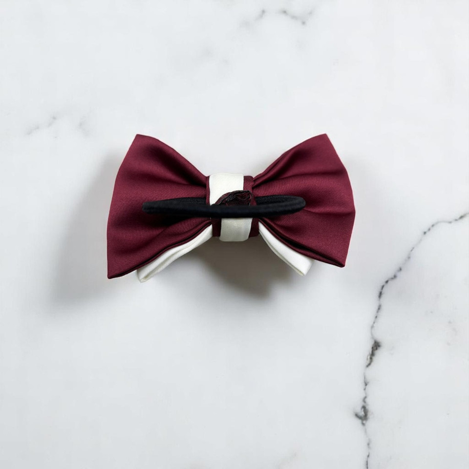 Tuhil Threads Small Royal Micro Satin Classic Bow in a two-tone design with a rich burgundy bottom layer and a cream top layer, neatly tied. Shop Tuhil Threads hair accessories.