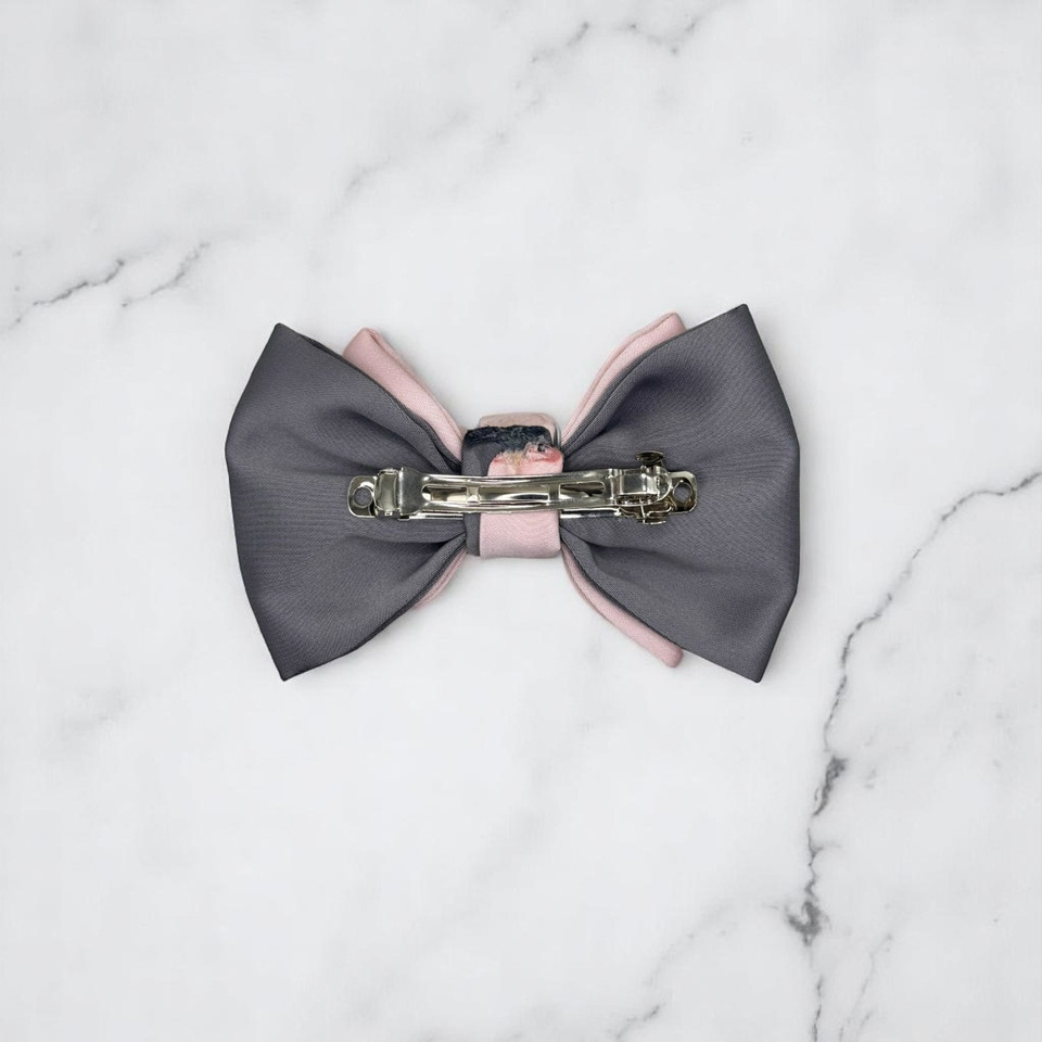 Tuhil Threads Small Royal Micro Satin Classic Bow in a two-tone design with a cool grey bottom layer and a soft pink top layer, neatly tied. Shop Tuhil Threads hair accessories.