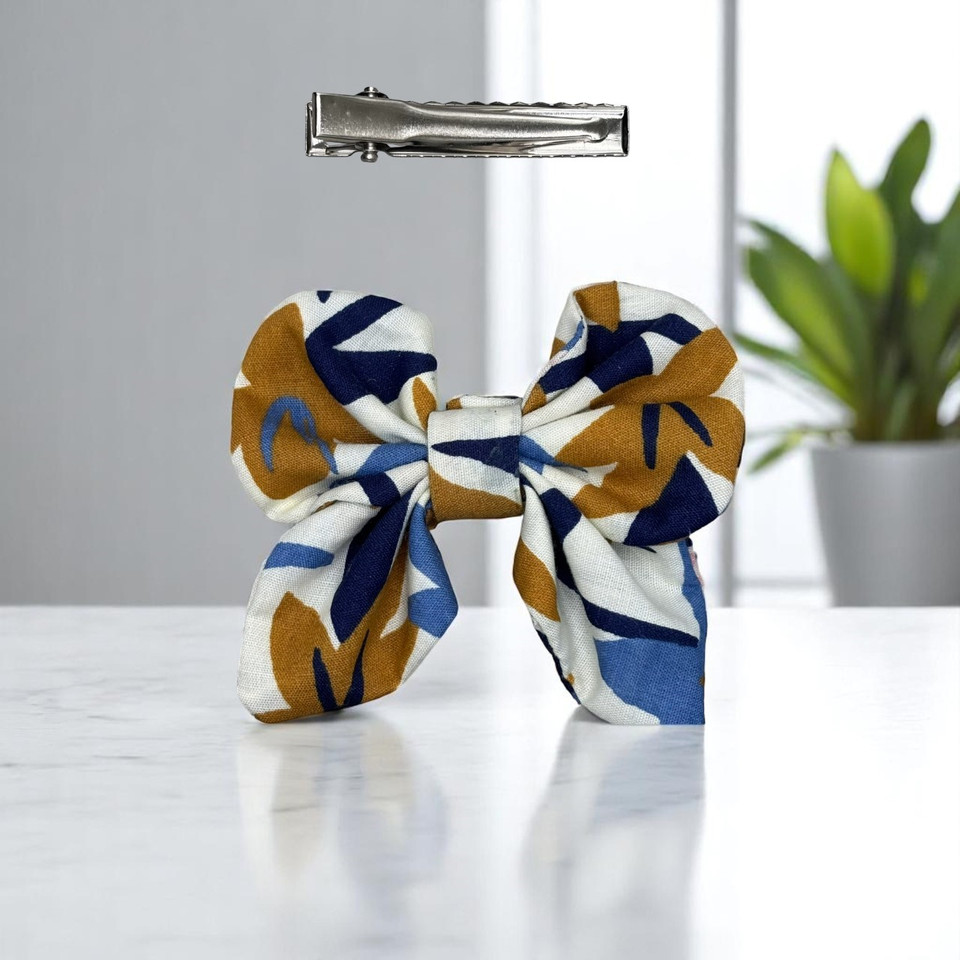 A stylish Abstract Floral Print Small Polycotton Butterfly Bow by Tuhil Threads, measuring approximately 10cm wide by 6cm high. Shop Tuhil Threads hair accessories.