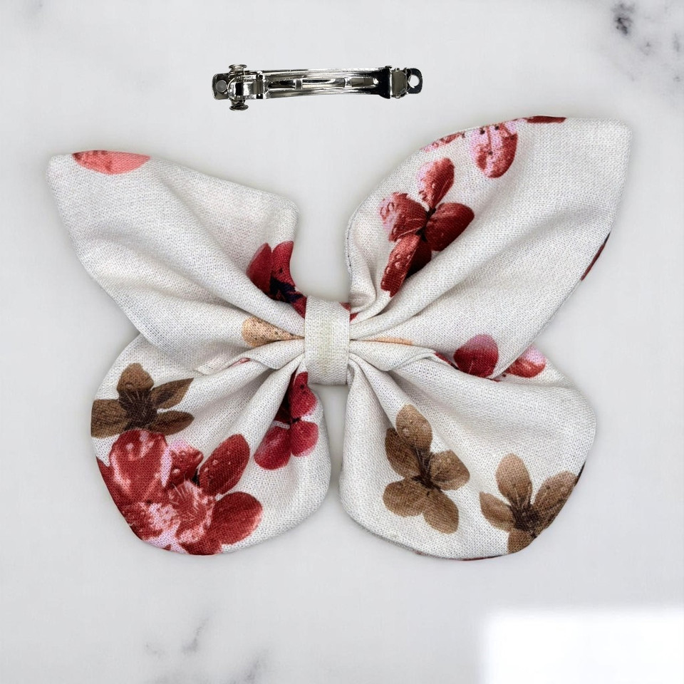 An elegant Dusty Blossom Floral Medium Cotton Butterfly Bow by Tuhil Threads, measuring approximately 12cm wide by 8cm high. Shop Tuhil Threads hair accessories.