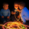 A calming sensory room featuring vibrant fiber optic lighting strands cascading in multiple colors, designed to create a mesmerizing visual display. This special needs fiber optic lighting setup provides safe tactile and visual sensory stimulation for children and adults with autism, ADHD, and sensory processing disorders. The glowing strands are arranged to encourage touch, engagement, and relaxation, making them ideal for sensory rooms, therapy clinics, and home calming corners.