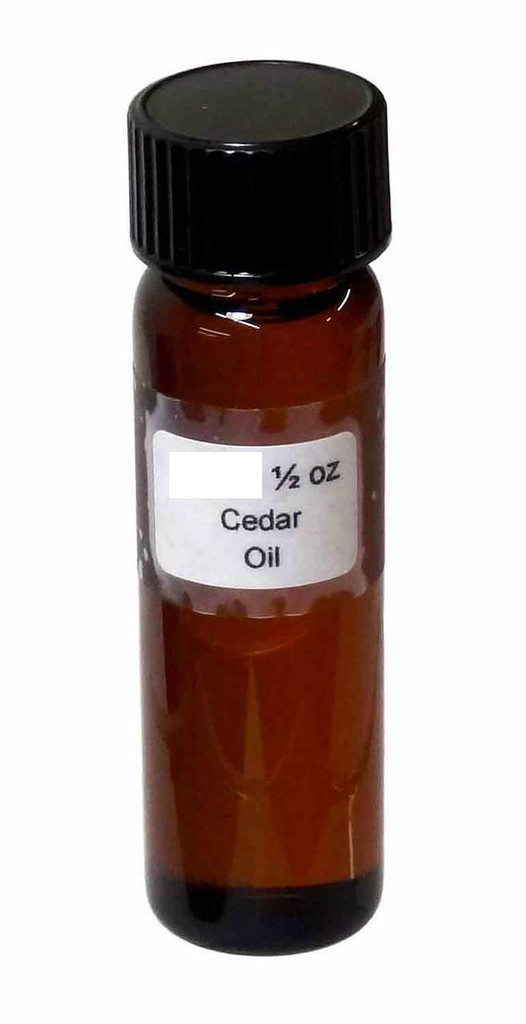 Cedar oil - Glass vial with plastic cap.