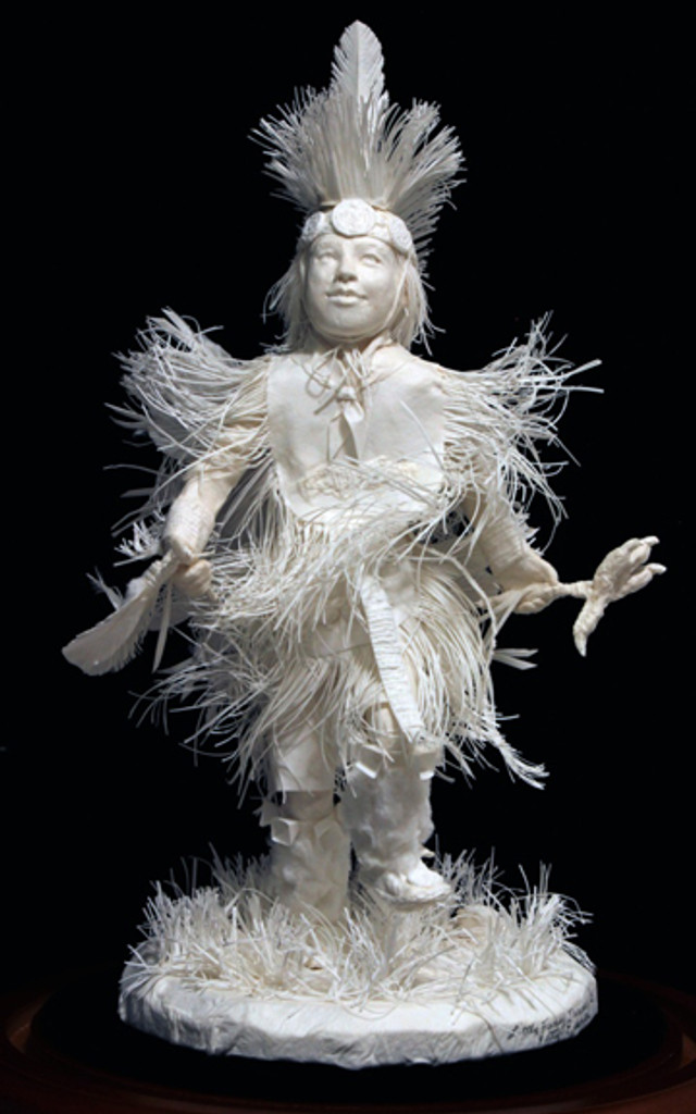 Front view of, "Little Fancy Dancer," cast paper sculpture by Patty Eckman featuring a young Native American dancing in full regalia.