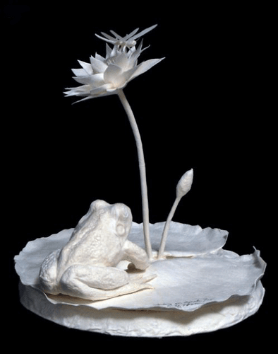 "Waiting for Lunch" paper sculpture by Patty Eckman features a frog and dragonfly.