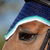 Upperville style shown in a navy base, with emerald, sea foam and snow trims, and two strands of matching beads.