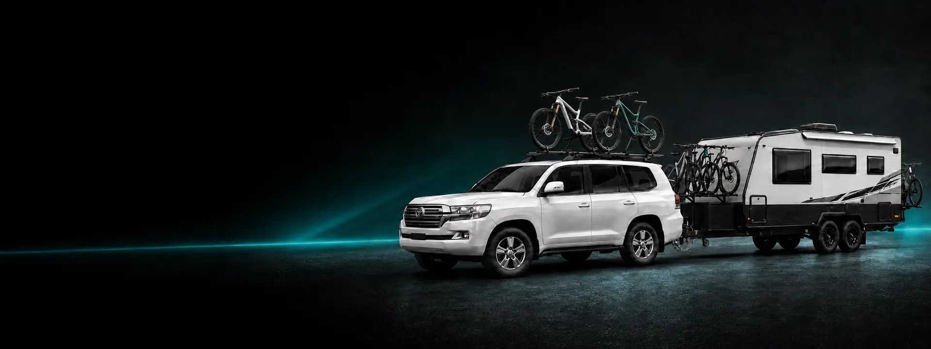LandCruiser and caravan carrying six bikes across purpose-built racks