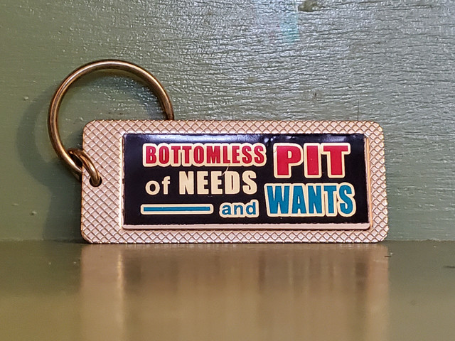 Vintage Bottomless Pit Wants Needs keychain