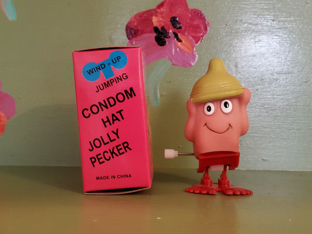 Jumping wind up condom hat penis