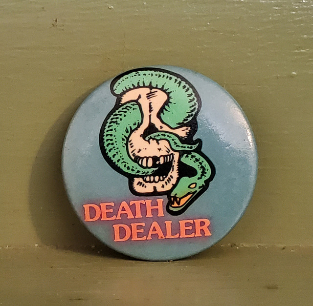 Death dealer snake skull pin button