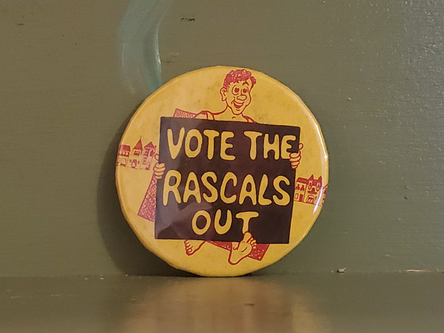 Vintage protest sign vote the rascals out pinback button