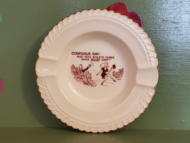 Vintage ashtray Confucius says man with athletic finger make broad jump pinup goose