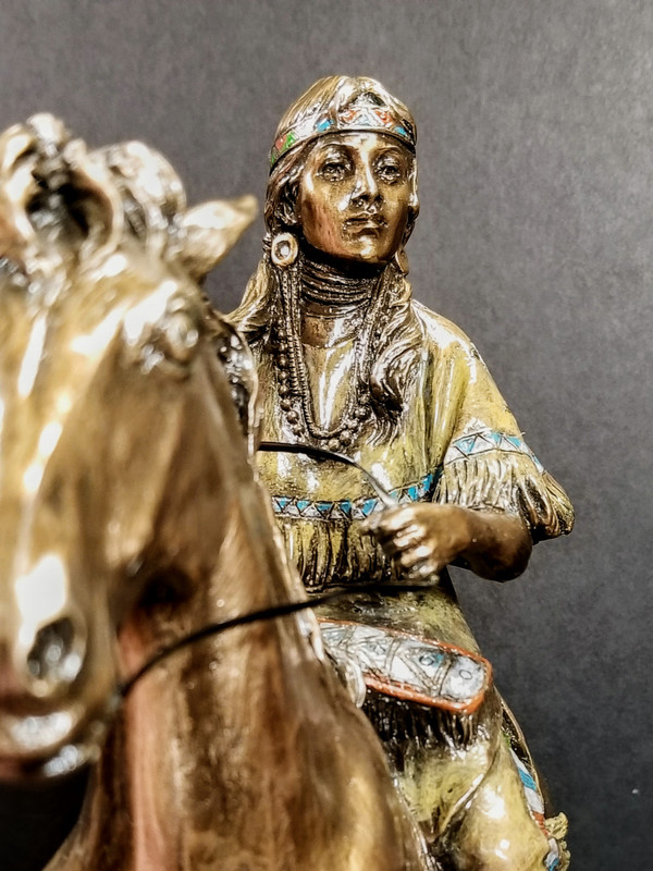 INDIAN WOMAN ON TROTTING HORSE