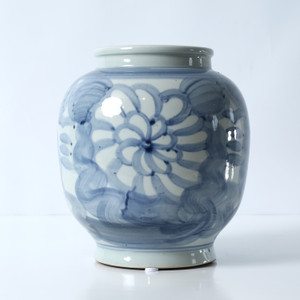 Approx. 10" Tall Blue and White Vase with Flower Motif Approx. 10" Tall Blue and White Vase with Flower Motif
